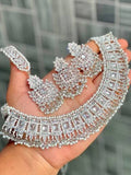 Silver imitation bridal jewellery set with ornate necklace and floral earrings